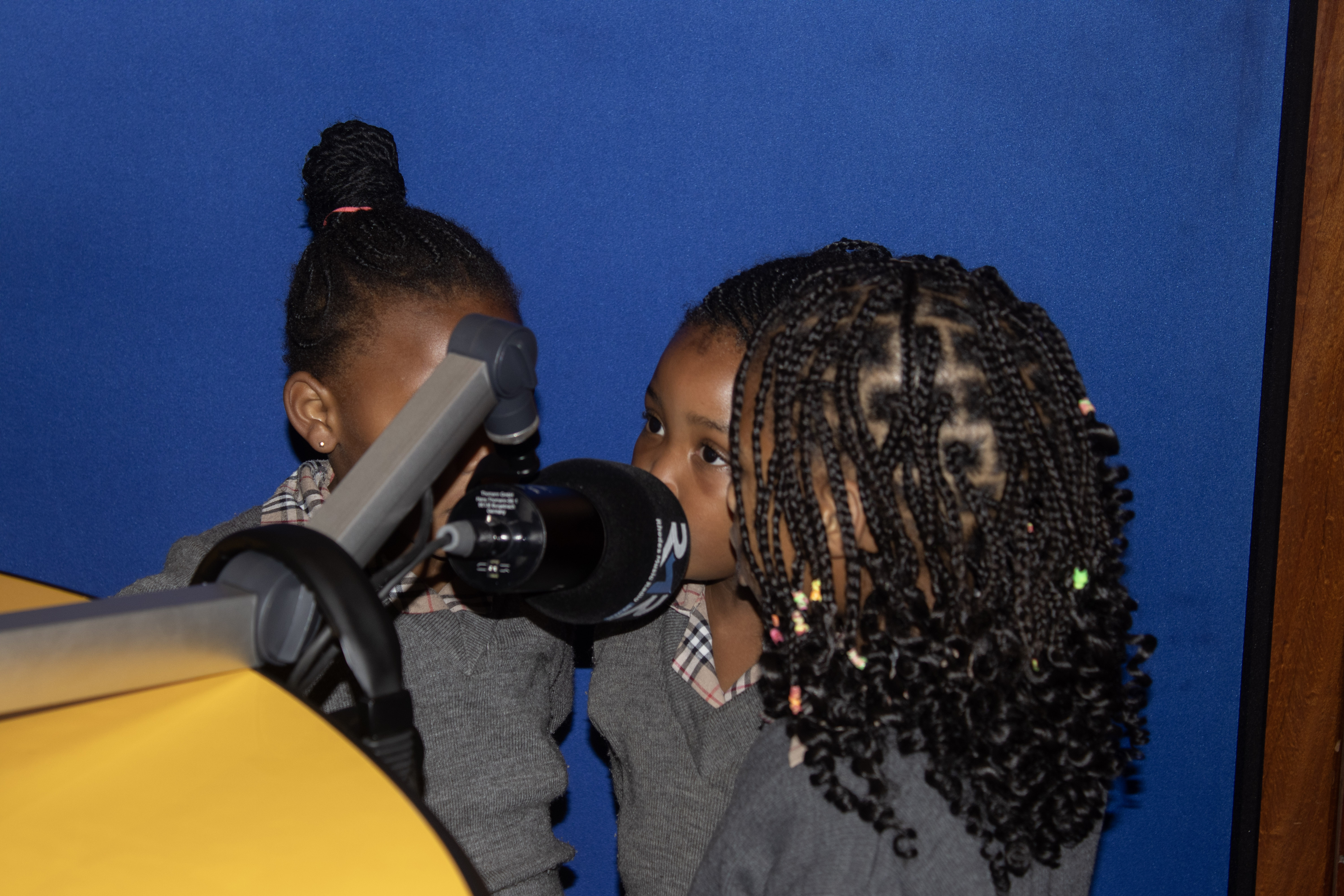 Two Playmates recording at the studio mic