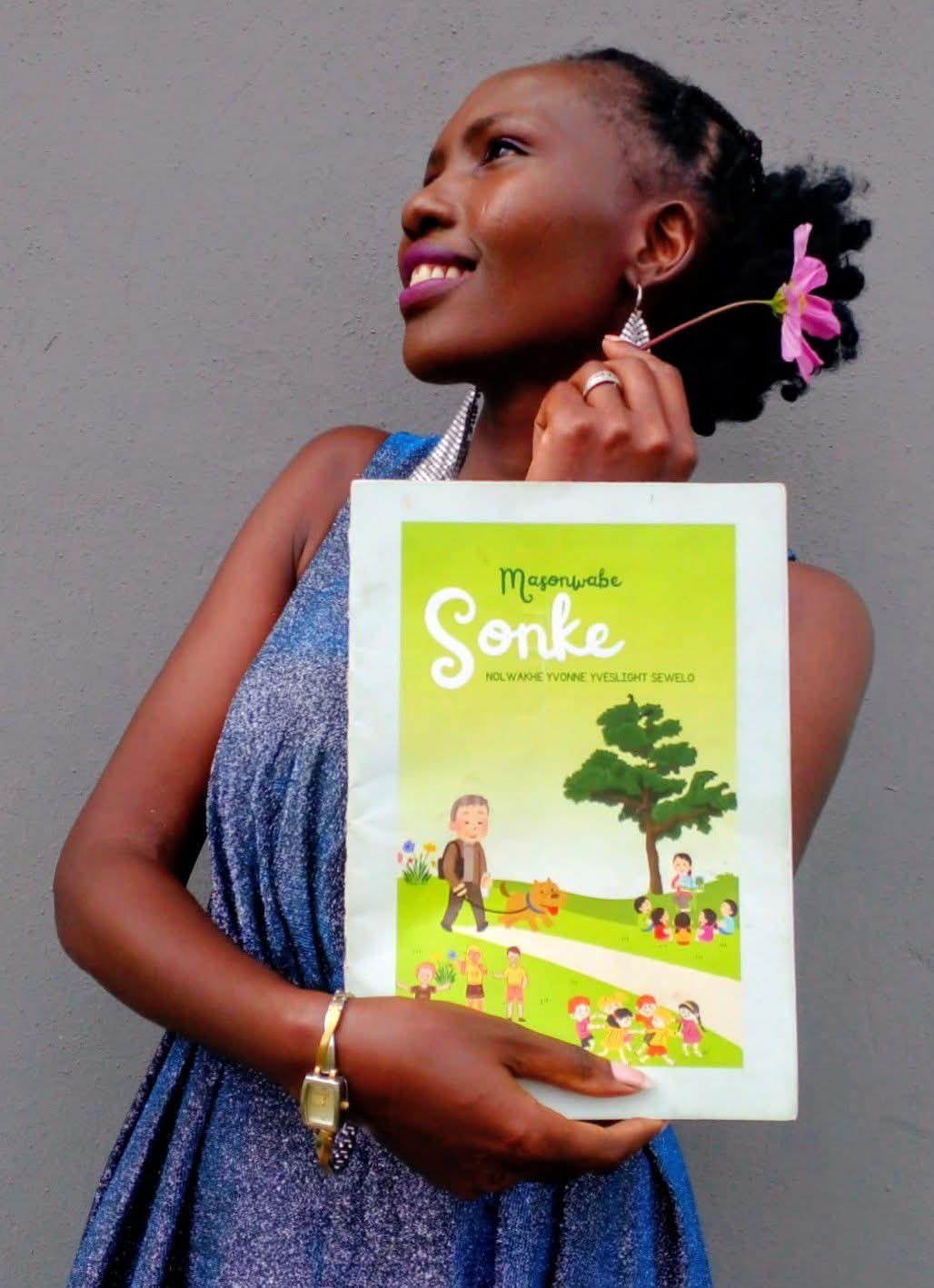 Nolwakhe Sewelo holding her book Masonwabe Sonke
