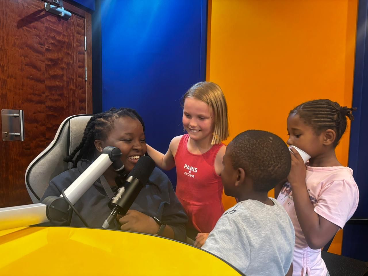 Rethabile laughing with Playmates in the studio