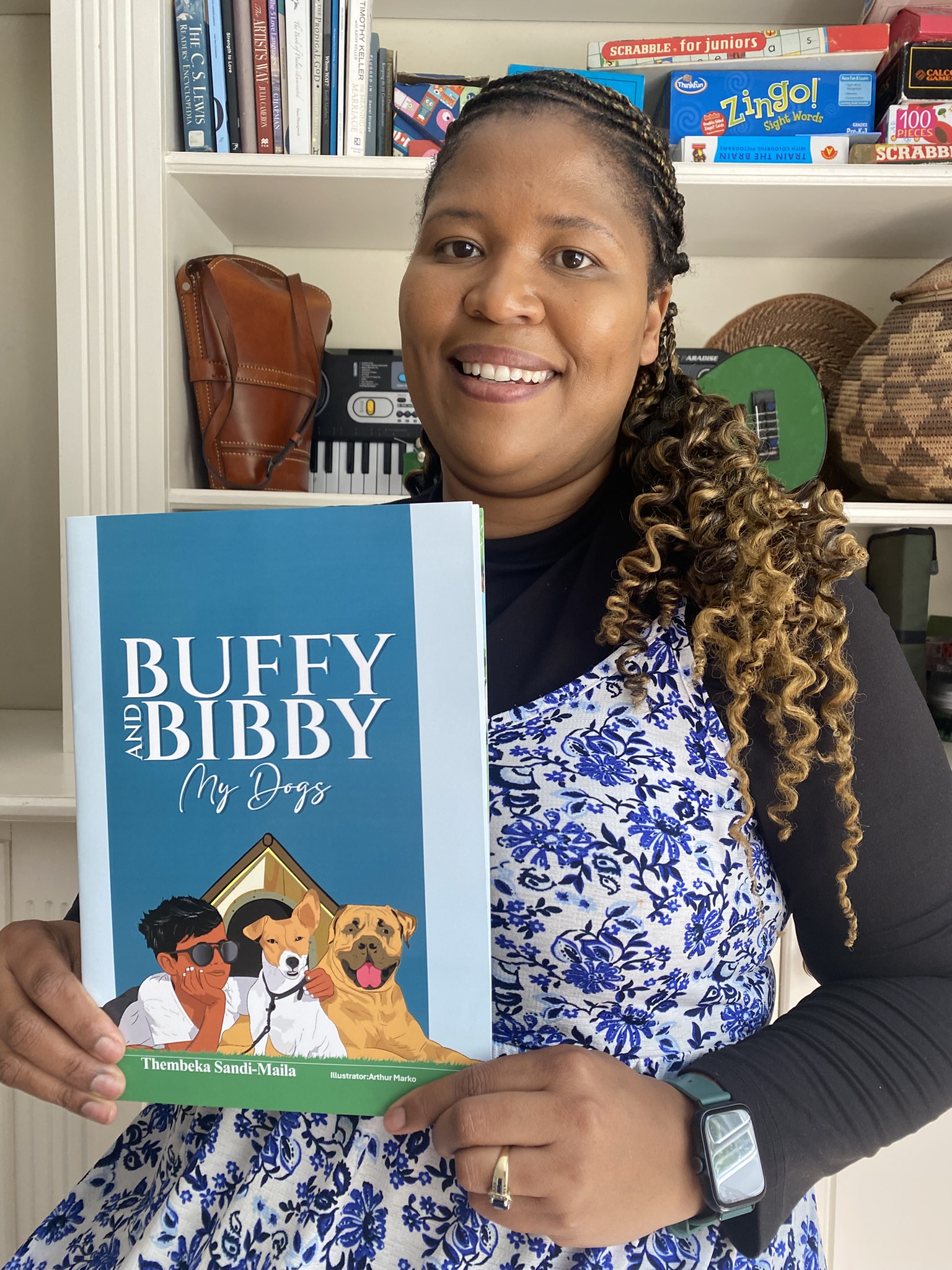 Thembeka Sandi-Maila with her book